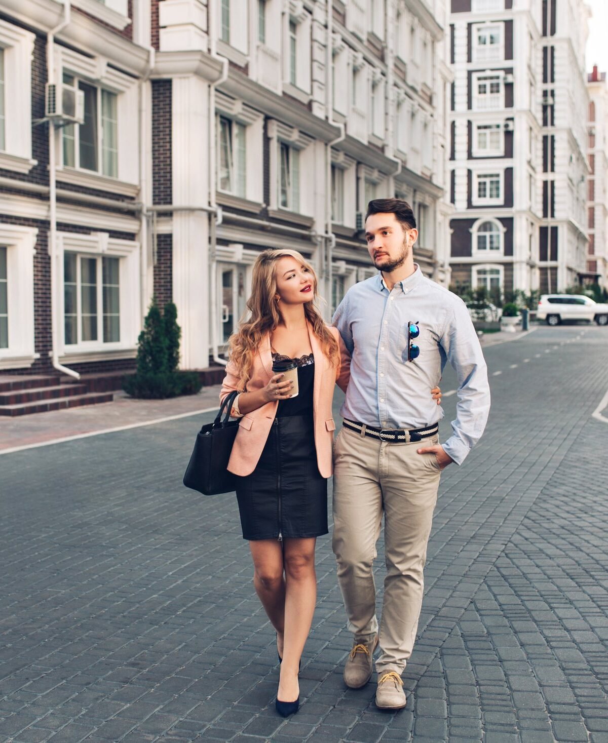 Couple walking together through a city street